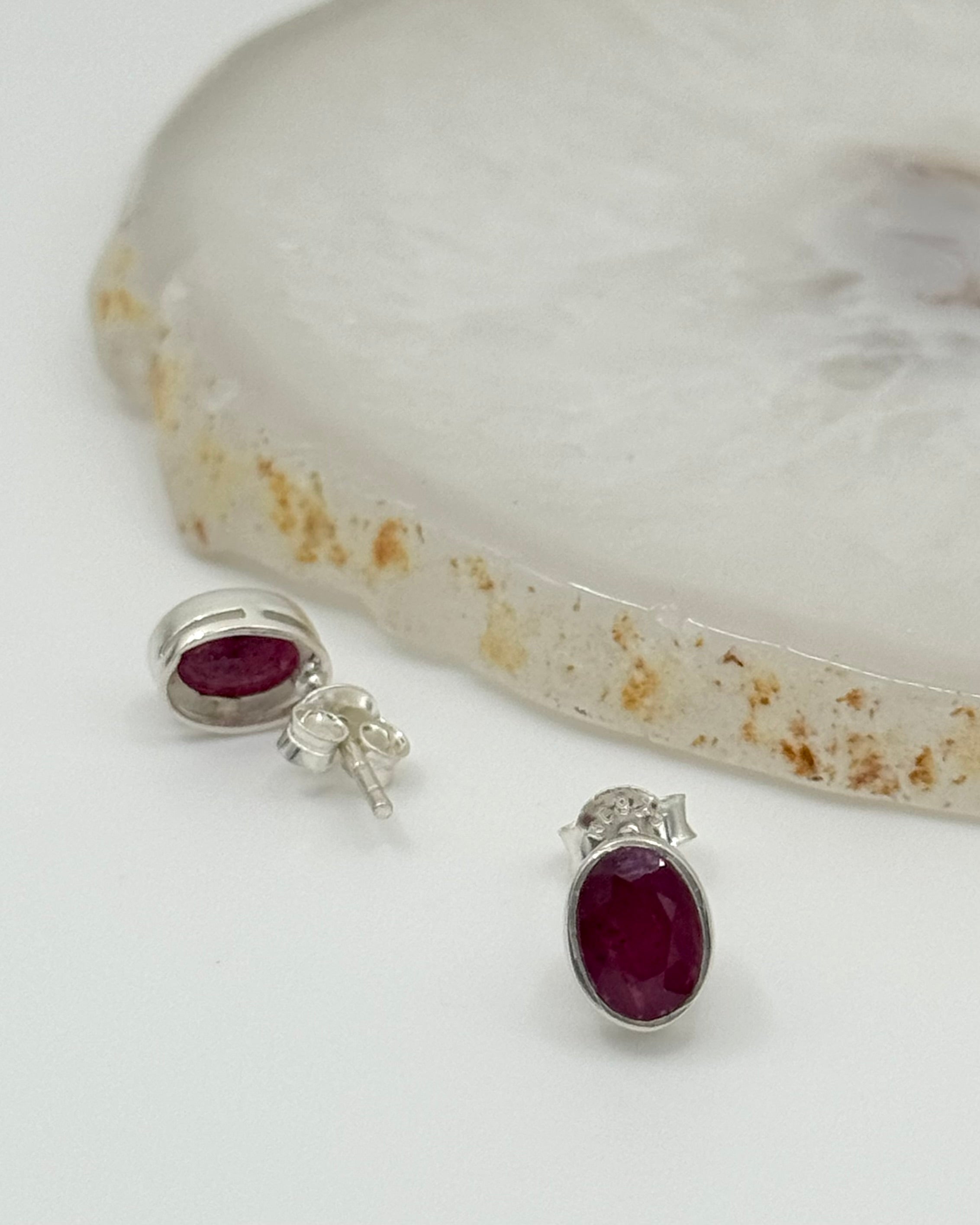 •FACETED RUBY - LIL' OVAL• silver bezel set stud earrings