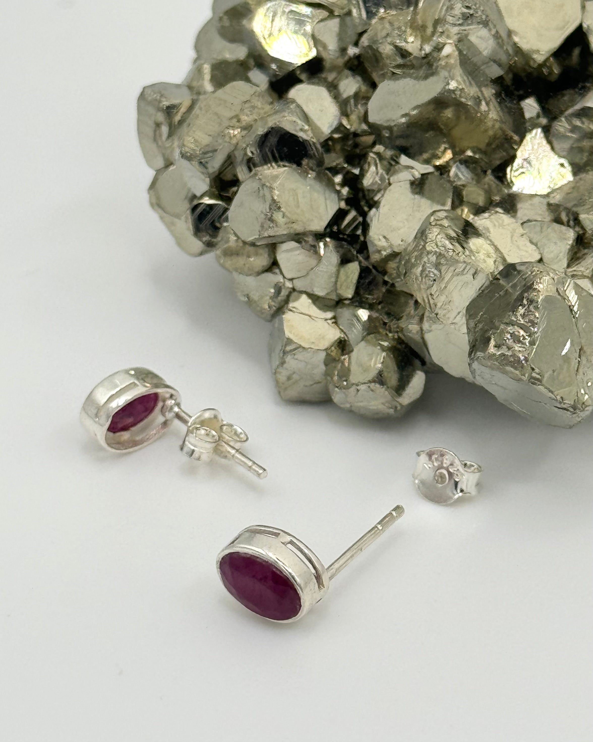 •FACETED RUBY - LIL' OVAL• silver bezel set stud earrings