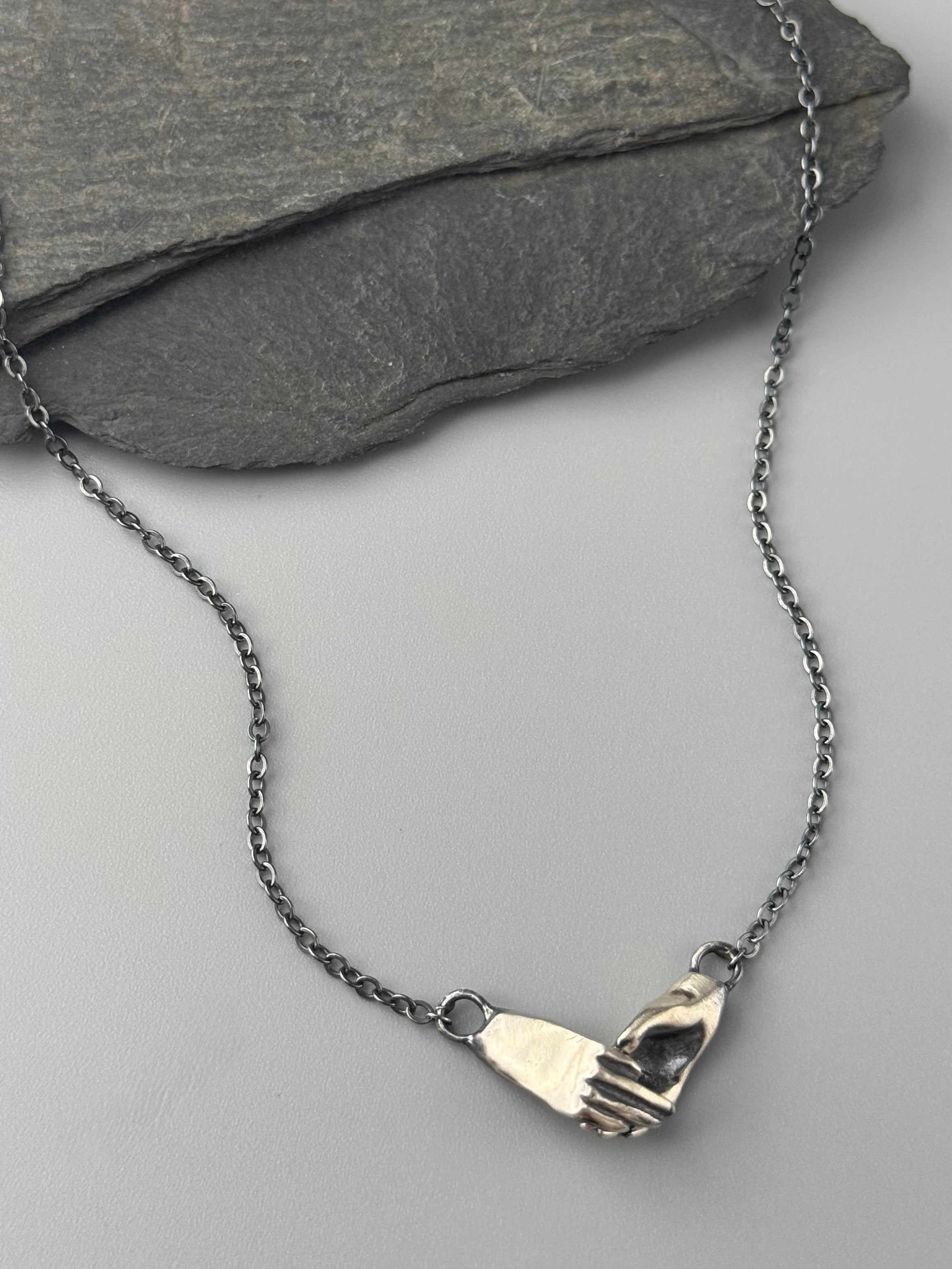 •HOLDING HANDS• oxidized silver necklace (18" long)
