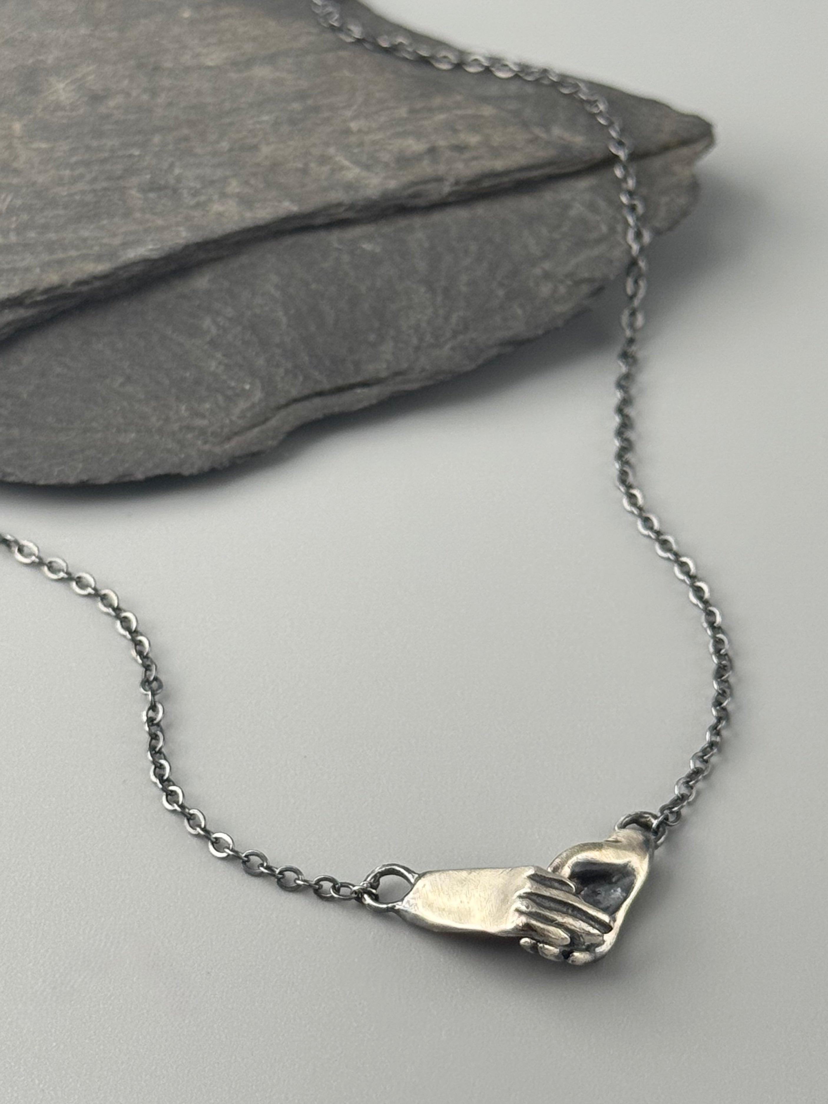 •HOLDING HANDS• oxidized silver necklace (18" long)