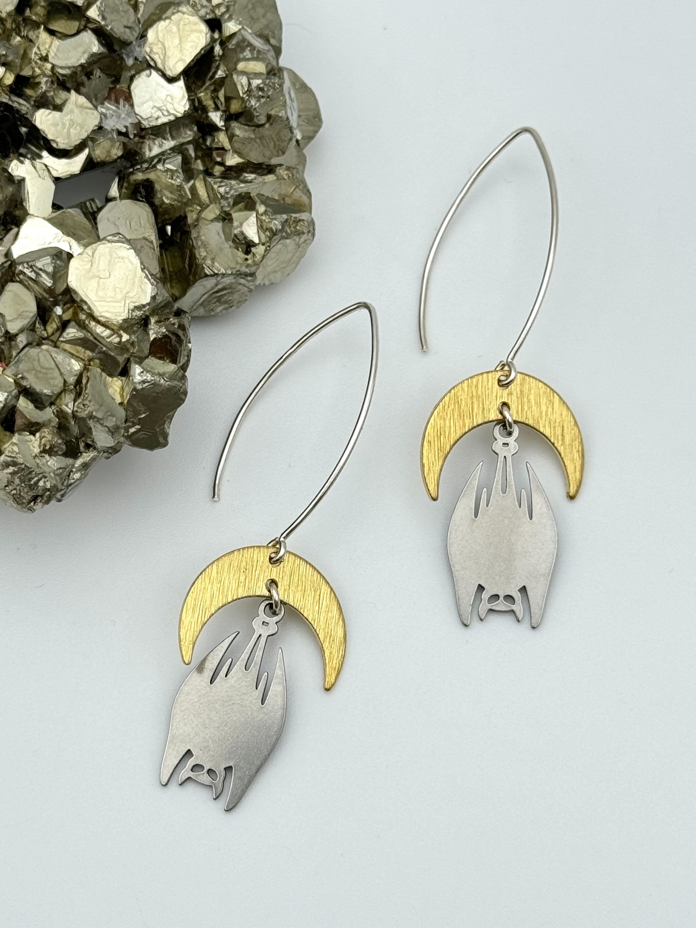 •DESMODONTINAE• mixed metal dangle earrings