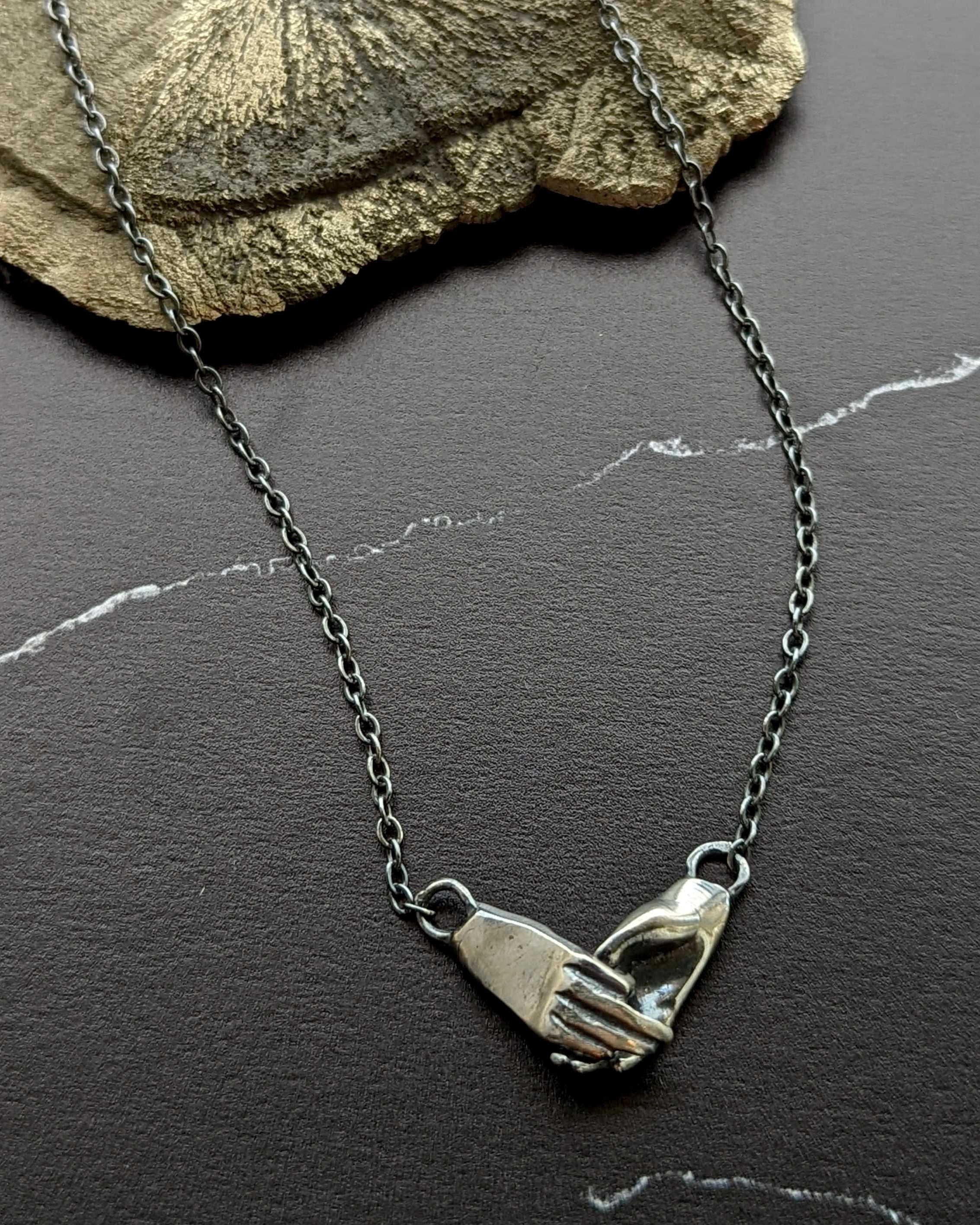 • HOLDING HANDS • silver necklace