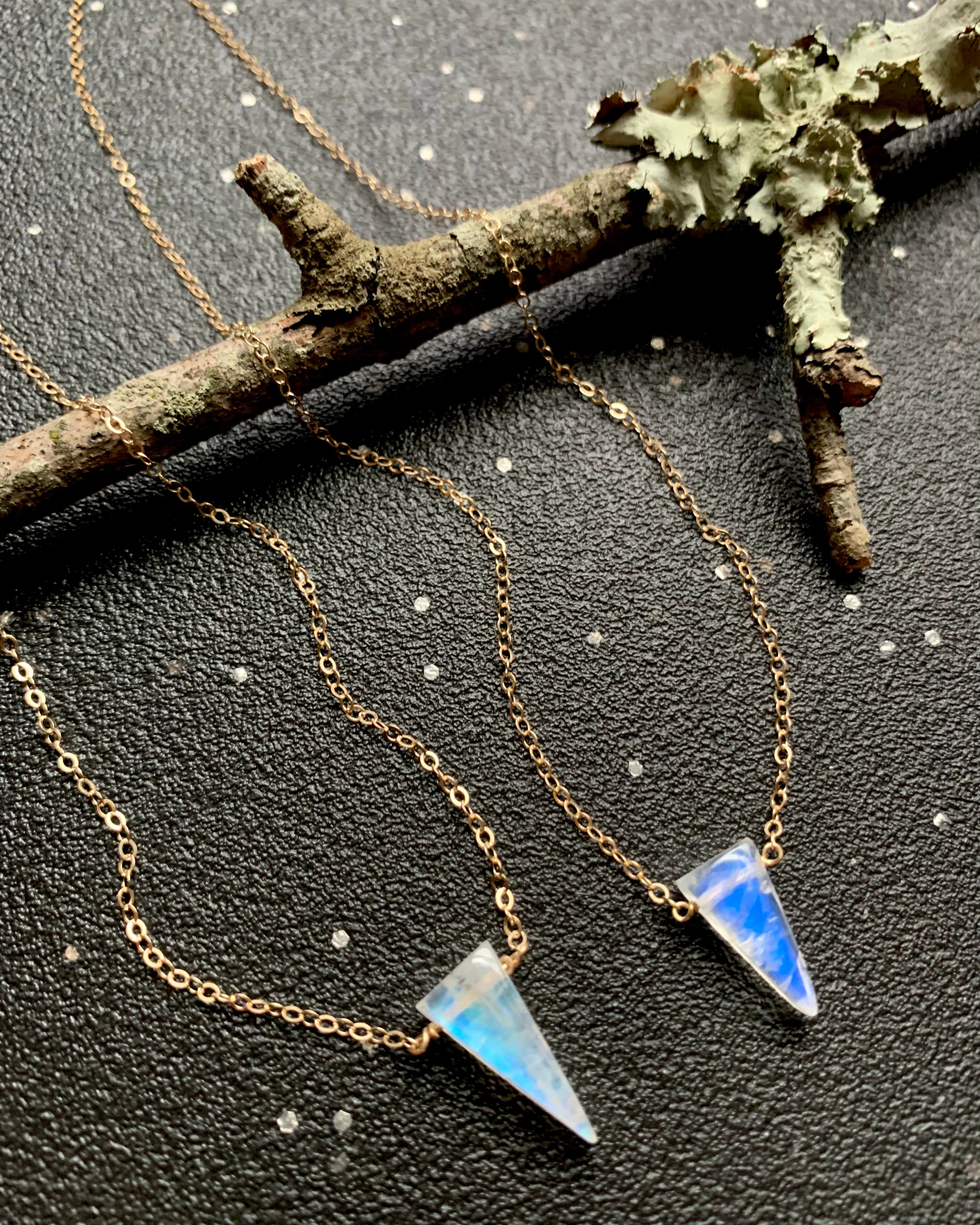 • STRAY • small rainbow moonstone fang + gold necklace